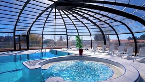 A pool area with a glass-enclosed structure, a hot tub, and lounge chairs. - Azureva - Roquebrune Cap Martin (Roquebrune-Cap-Martin)