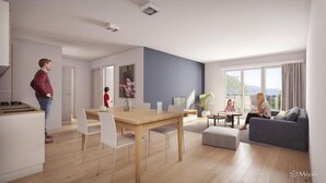 A modern living room with a grey sofa, a wooden dining table, and a kitchen area with a stove. - Azureva - Roquebrune Cap Martin (Roquebrune-Cap-Martin)