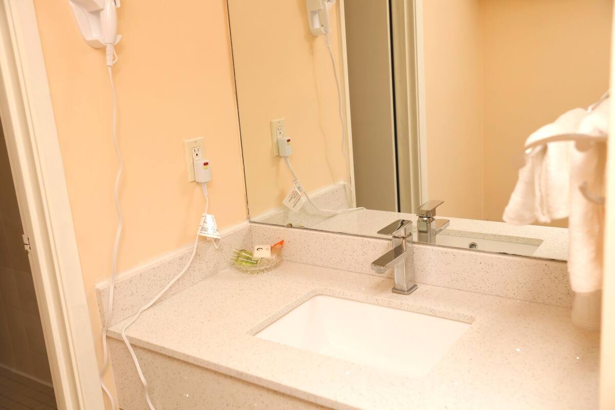 bathtub, hair dryer, towels