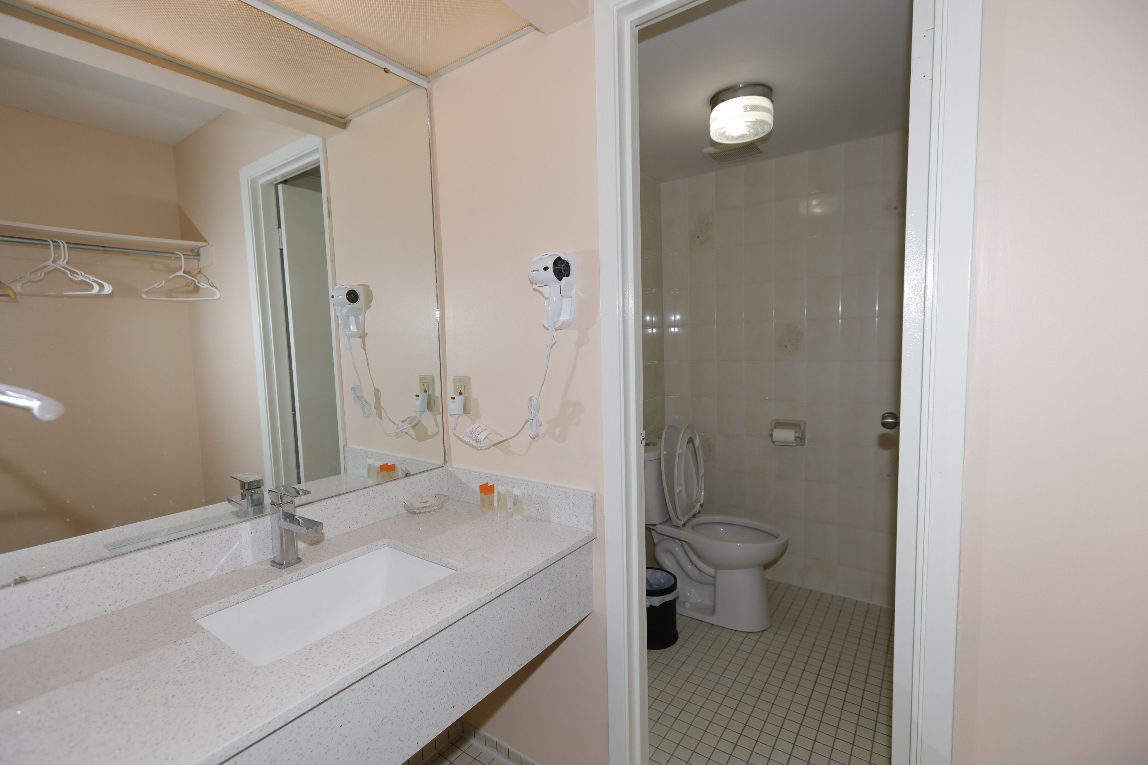 bathtub, hair dryer, towels