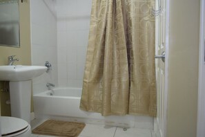 Apartment, 1 King Bed, Non Smoking | Bathroom | Shower, free toiletries, hair dryer, towels