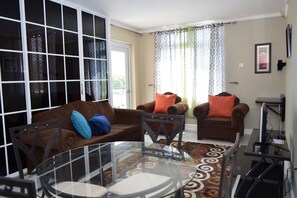 Apartment, 1 King Bed, Non Smoking | Living room - The Strathairn 305 by Pro Homes Jamaica (Kingston)
