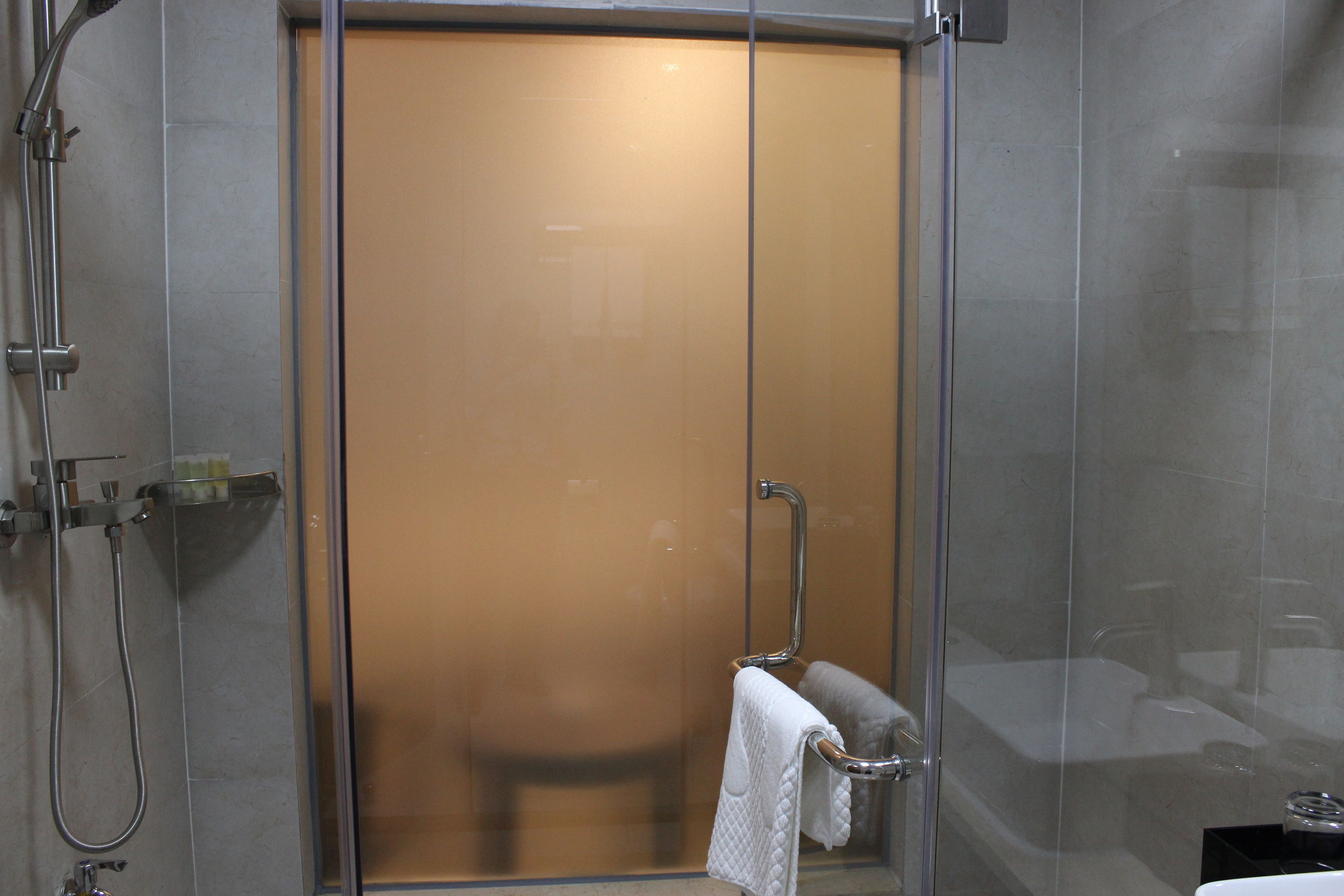 romantic room with round bed | bathroom | shower, rainfall showerhead, free toiletries, hair dryer