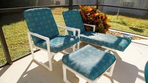 Two blue cushioned chairs with white frames on a covered patio. - Ly53763 - Indian Ridge - 4 Bed 2 Baths Villa (Kissimmee)