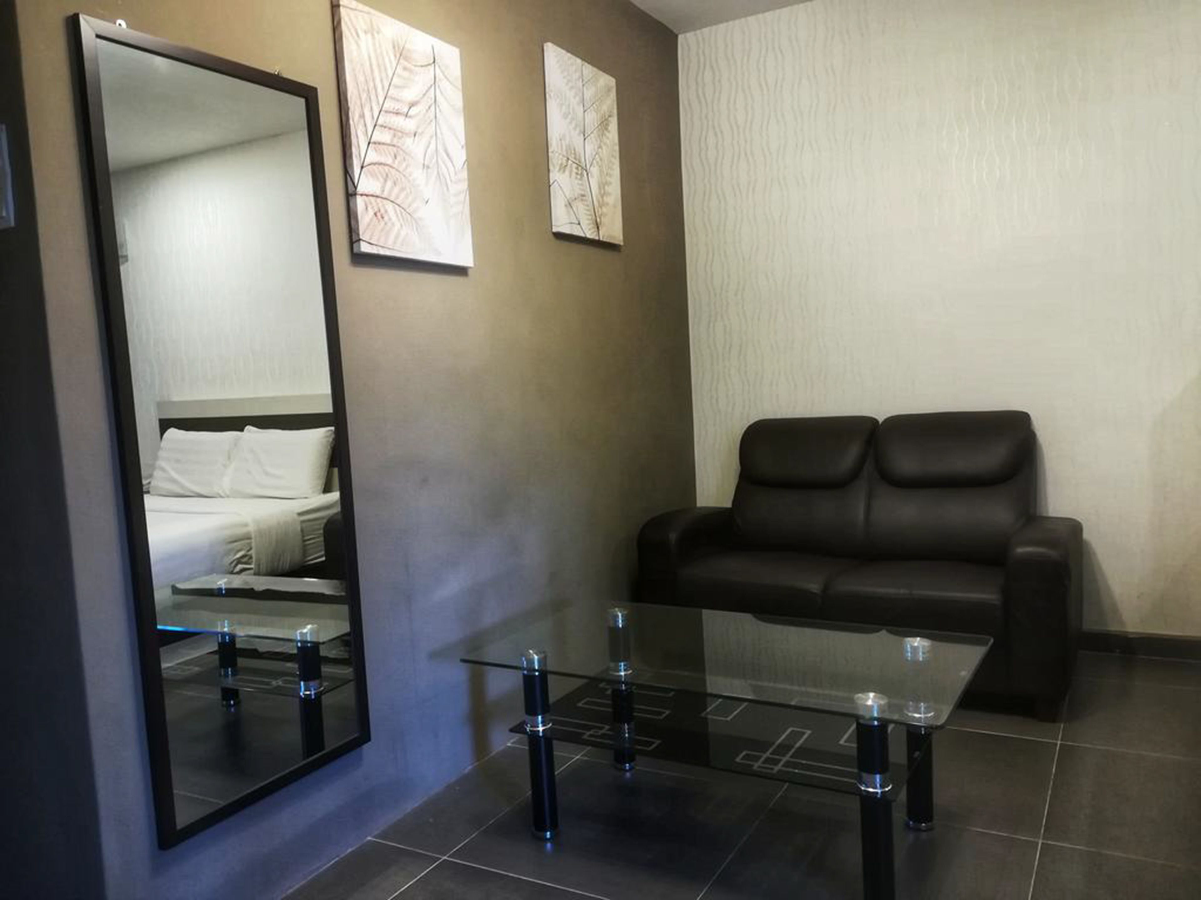 deluxe triple room | living area | led tv