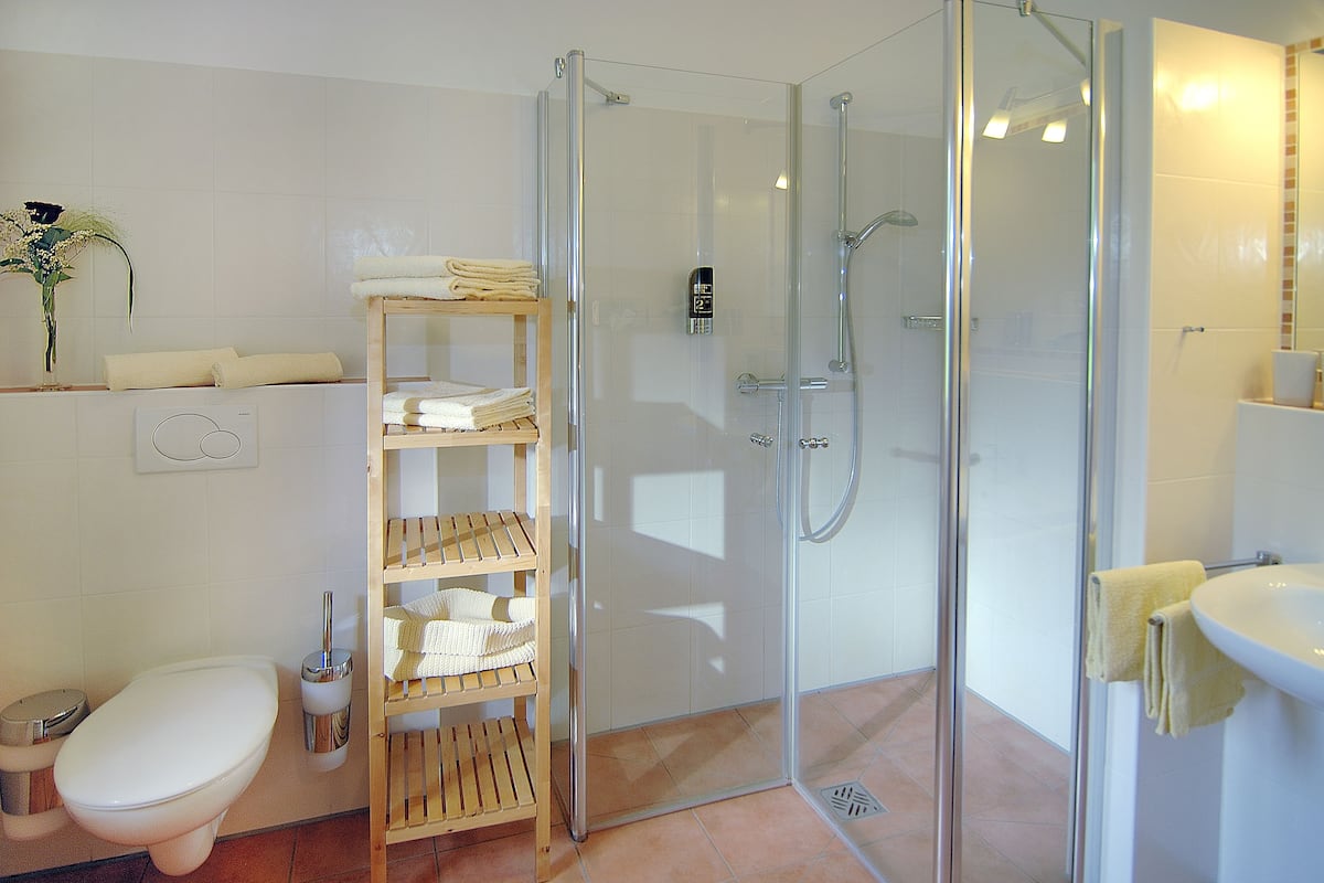 premium apartment | bathroom | shower, free toiletries, hair dryer, towels
