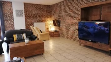 Appartement | Woonkamer | Een plasmatelevisie