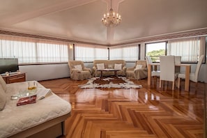 Apartment, Multiple Beds | Living room | TV