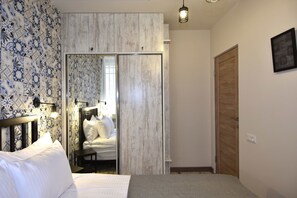 Apartamento, 1 quarto | 1 quarto, individualmente mobiliados, escrivaninha, cortinas blackout