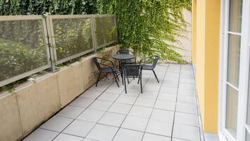 Suíte, varanda | Terraço/pátio