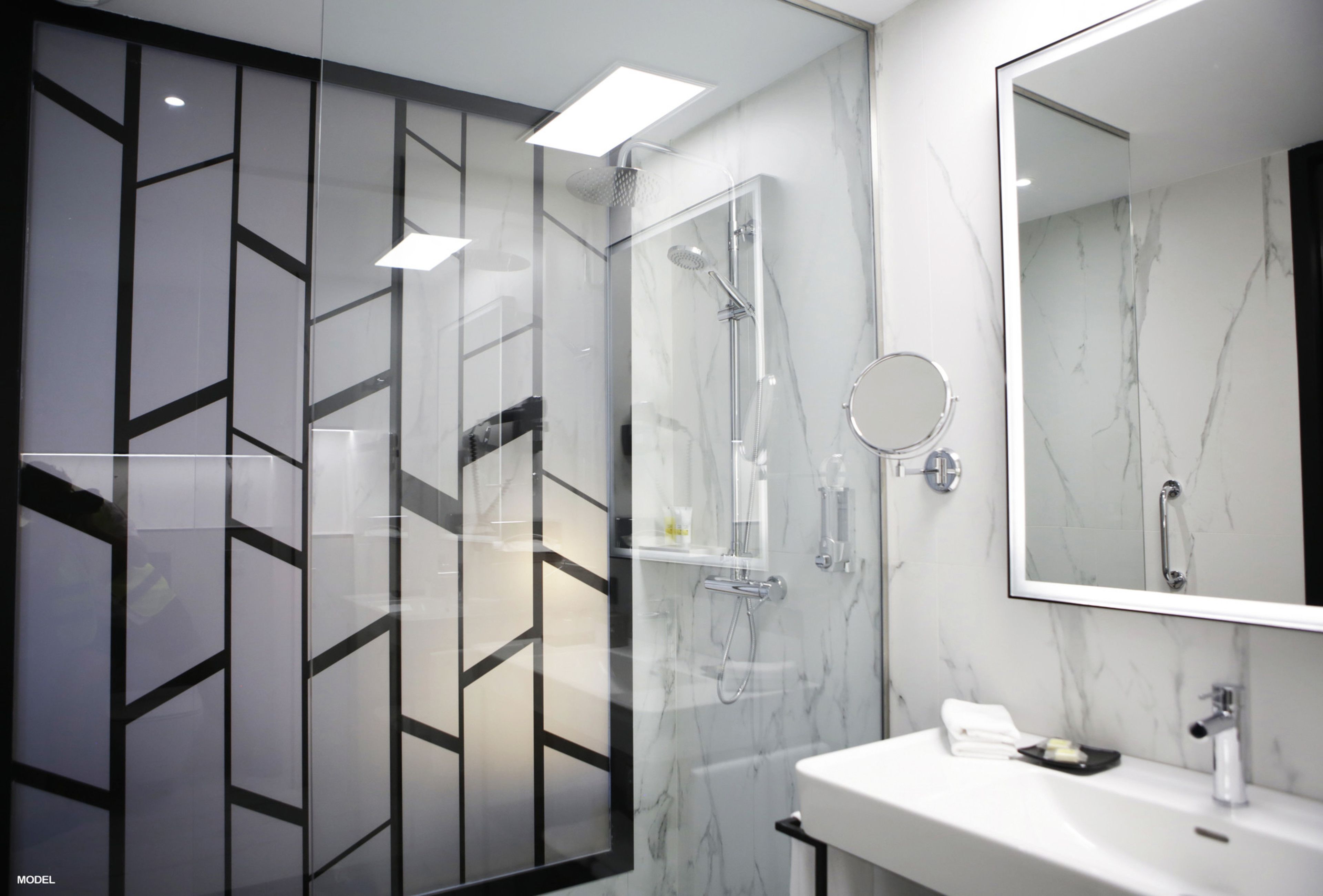 deluxe room (superior king) | bathroom | shower, rainfall showerhead, eco-friendly toiletries, hair dryer