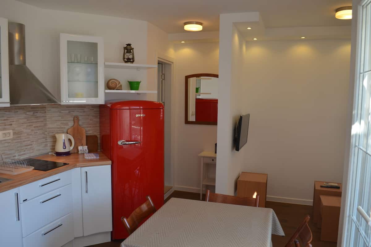 Superior-Apartment, 1 Queen-Bett und Schlafsofa | Essbereich im Zimmer