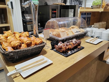 Daily self-service breakfast for a fee. Ibis Budget Saint Genis Pouilly Geneva