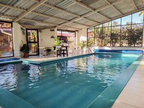 Indoor pool, open 8 AM to 4:00 PM, pool umbrellas