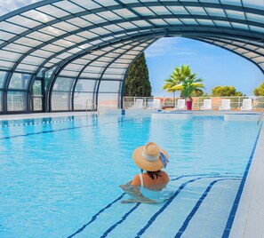 Indoor pool, pool umbrellas, sun loungers
