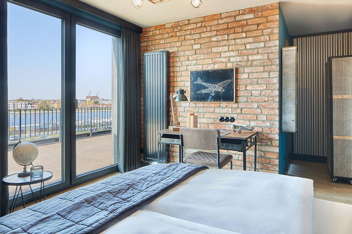 Premium bedding, desk, laptop workspace, blackout drapes