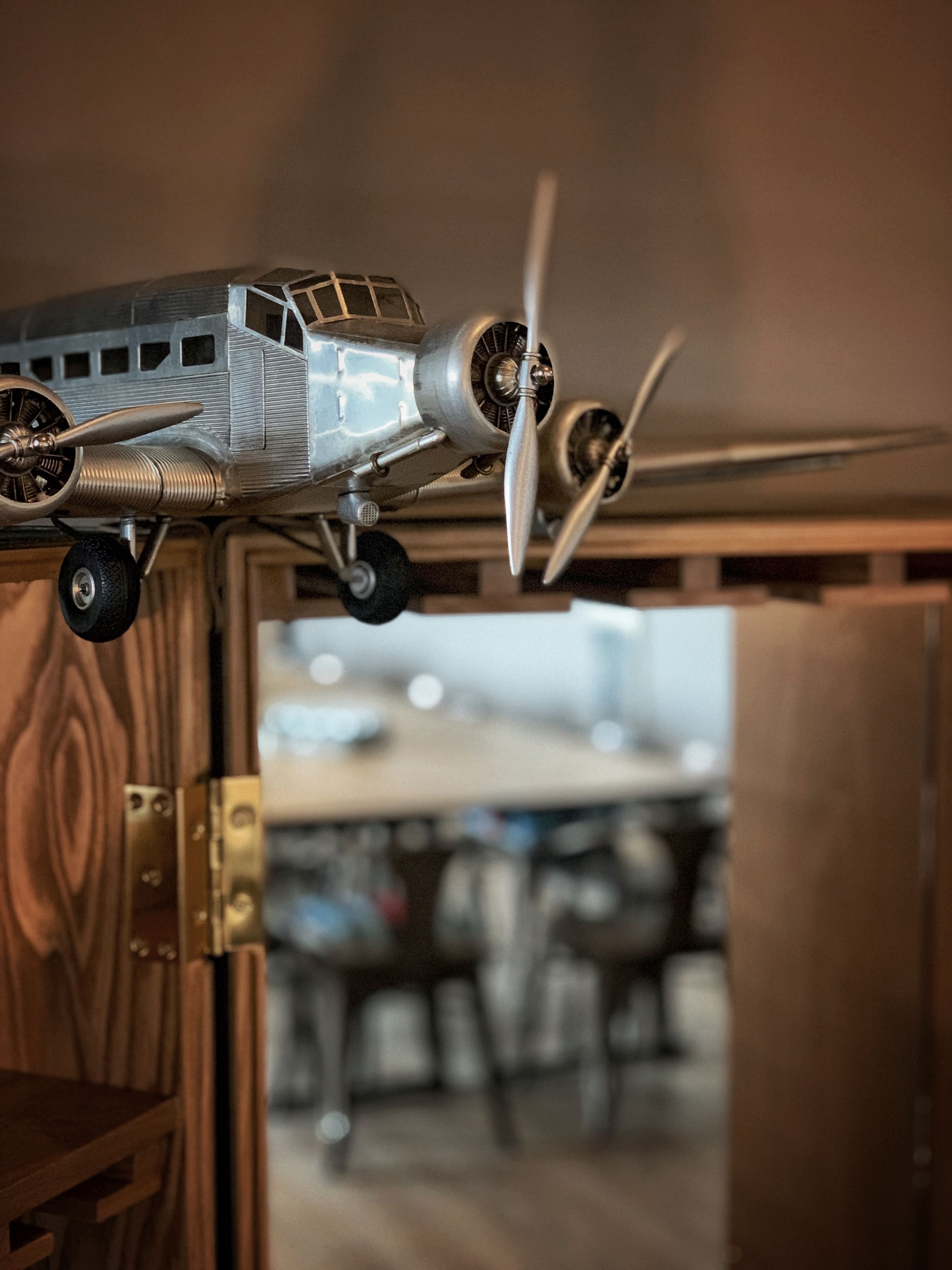 A model airplane on a shelf.