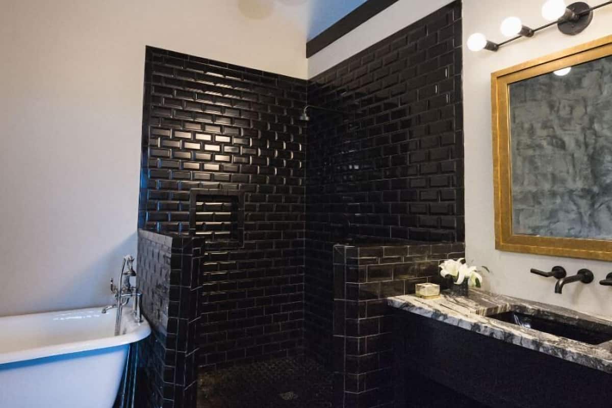 superior suite, 1 king bed with sofa bed, bathtub | bathroom | designer toiletries, hair dryer, bathrobes