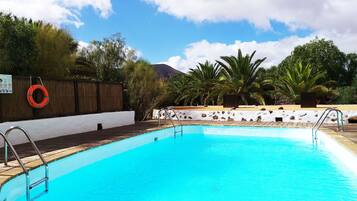 Outdoor pool, open 10:00 AM to 8:00 PM, pool loungers