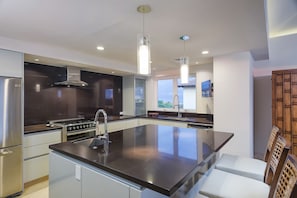 Exclusive Condo, 4 Bedrooms | Private kitchen | Full-size fridge, oven, stovetop, cookware/dishes/utensils