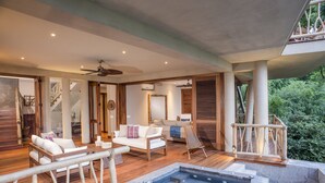 A spacious outdoor area with a hot tub, wooden deck, and seating area. - Treehouse Punta Sayulita by Tripwix (Sayulita)