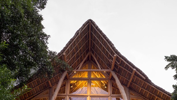 A multi-story building with a wooden facade and balconies, surrounded by lush greenery. - Treehouse Punta Sayulita by Tripwix (Sayulita)