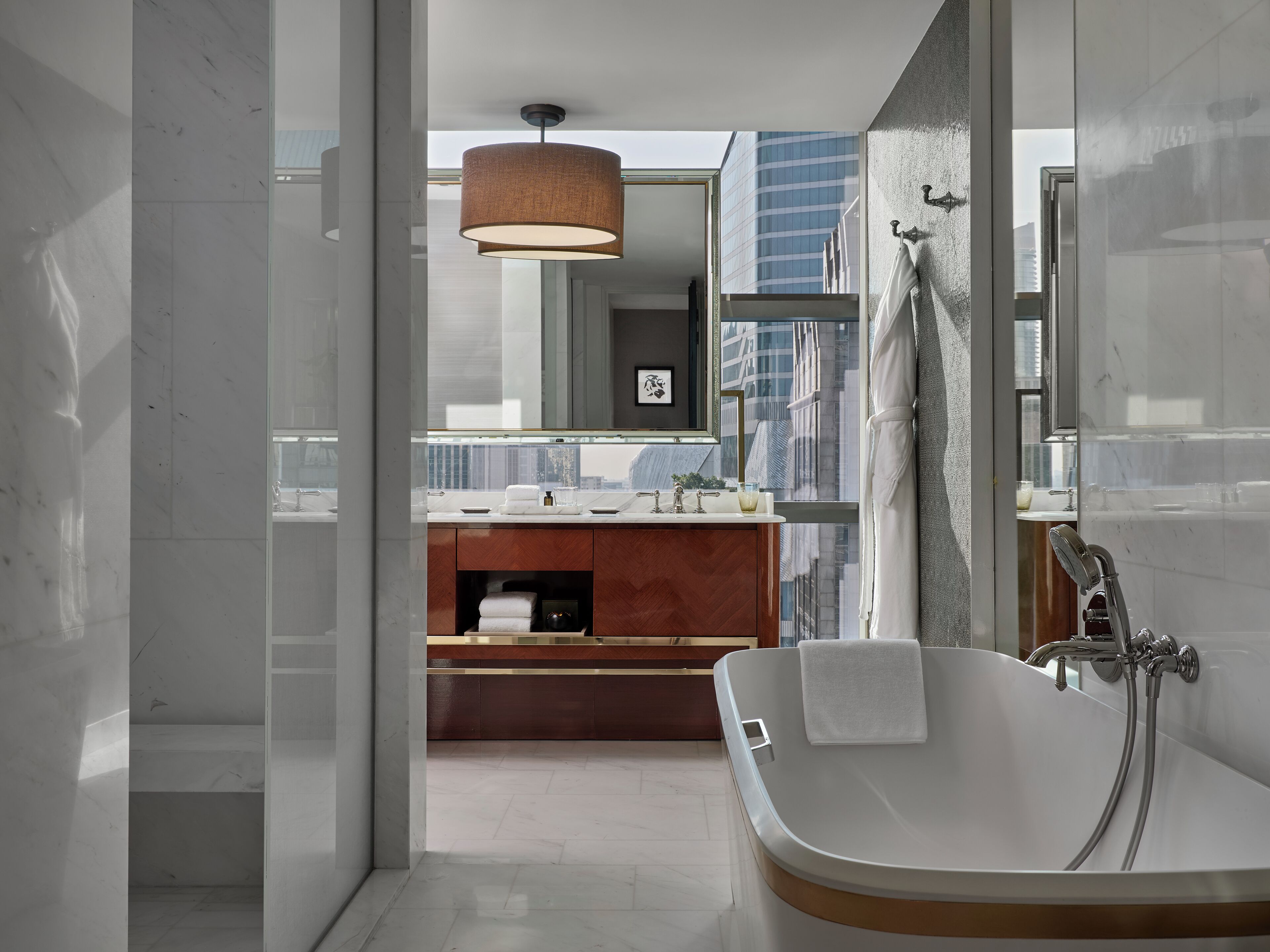 separate bathtub and shower, deep-soaking bathtub, designer toiletries