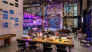 A modern lounge area with a pool table, bar, and comfortable seating. - Moxy Washington DC Downtown (Washington)