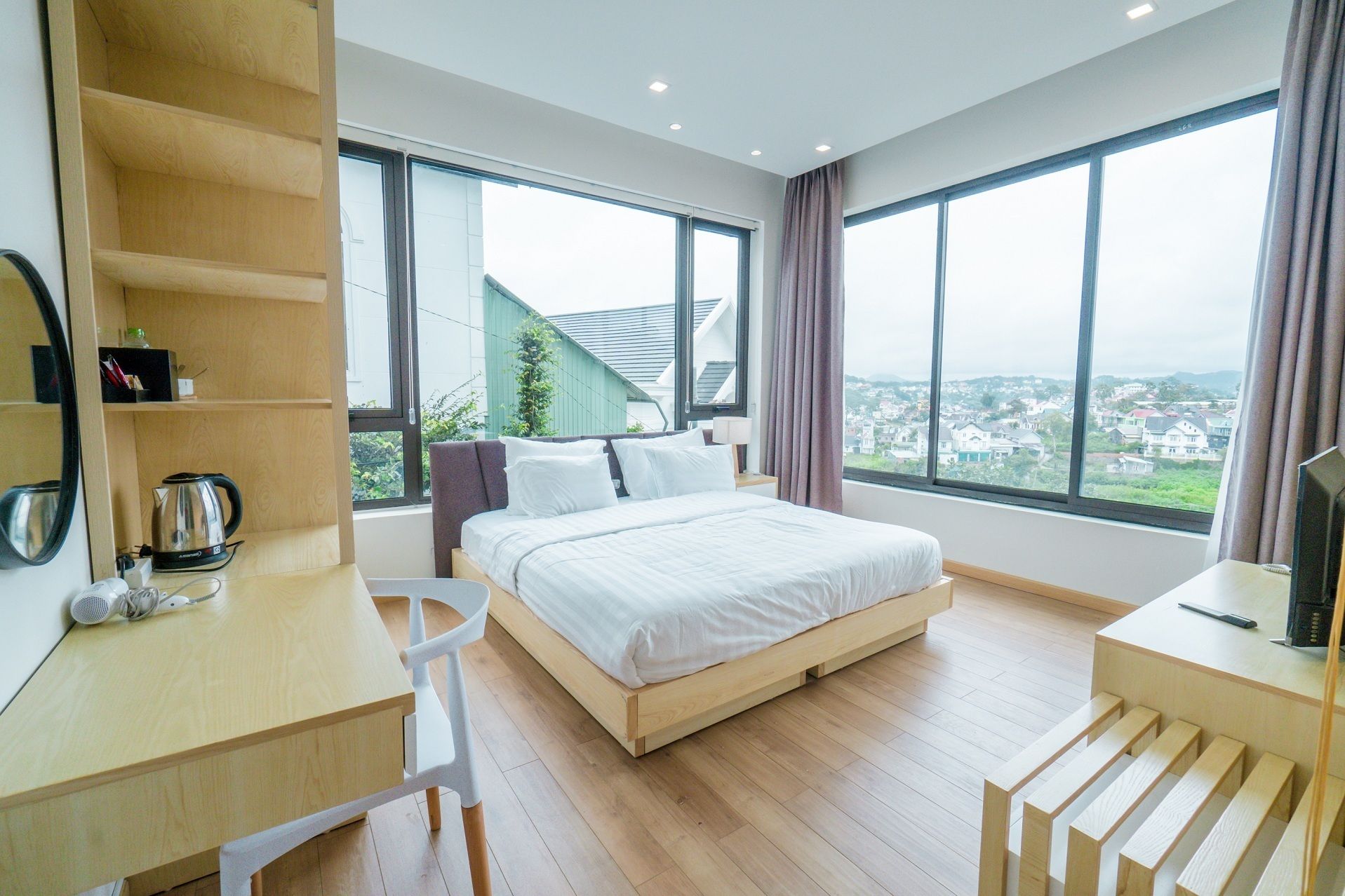 deluxe room, city view | desk, blackout curtains, iron/ironing board, free cots/infant beds