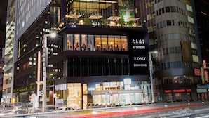 A modern hotel with multiple floors, large windows, and a prominent signage for 'SABATINI'. - The Gate Hotel Tokyo By HULIC (Tokyo)