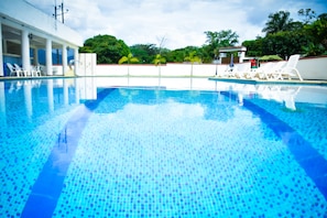 Outdoor pool, open 10 AM to 8 PM, pool loungers