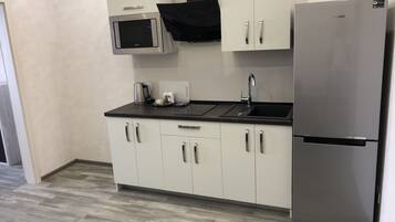 Family Apartment, 1 Queen Bed with Sofa bed | Private kitchen | Full-sized fridge, microwave, stovetop, coffee/tea maker