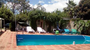 Seasonal outdoor pool, pool loungers