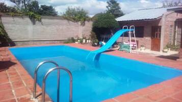 Seasonal outdoor pool, pool loungers