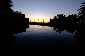 Seasonal outdoor pool, pool umbrellas, pool loungers