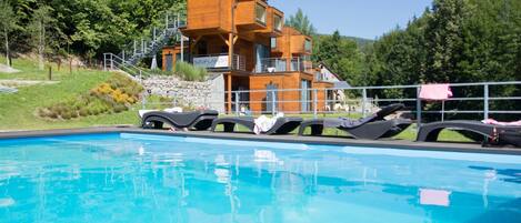 Seasonal outdoor pool, pool loungers