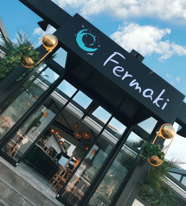 A modern storefront with a sign reading "Fermaki." - Fermaki Rooms - Adults Only (Urla)