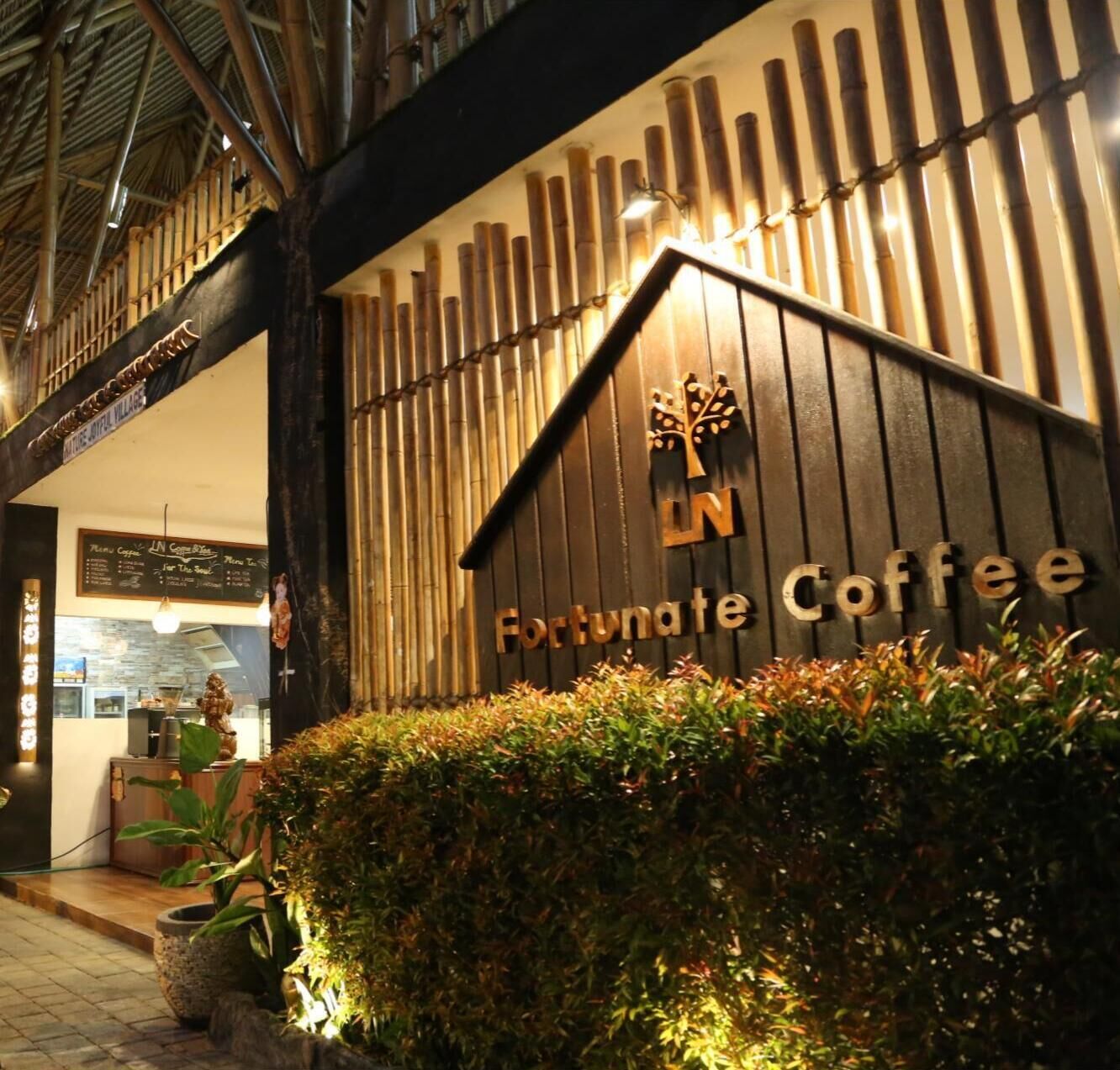 A wooden facade with a sign reading 'Fortunate Coffee.'