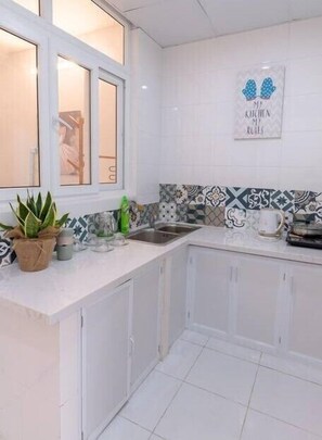 Fridge, stovetop, cookware/dishes/utensils - Commodious Basic Apart 2BRs (Hanoi)