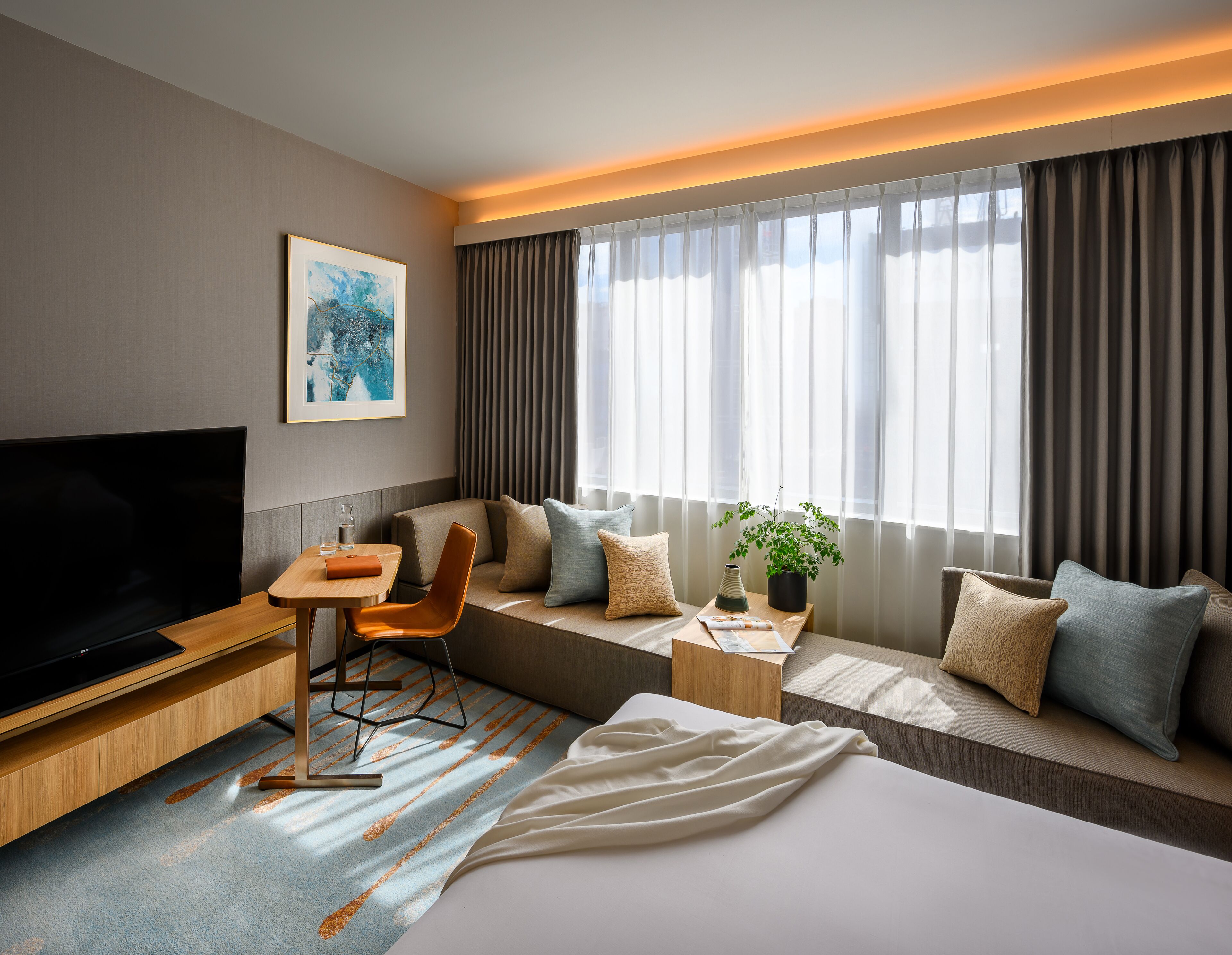 deluxe room, 1 king bed | living area | flat-screen tv