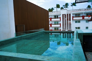 Outdoor pool, open 9:00 AM to 7:00 PM, pool umbrellas, sun loungers