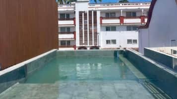 Outdoor pool, open 9:00 AM to 7:00 PM, pool umbrellas, pool loungers