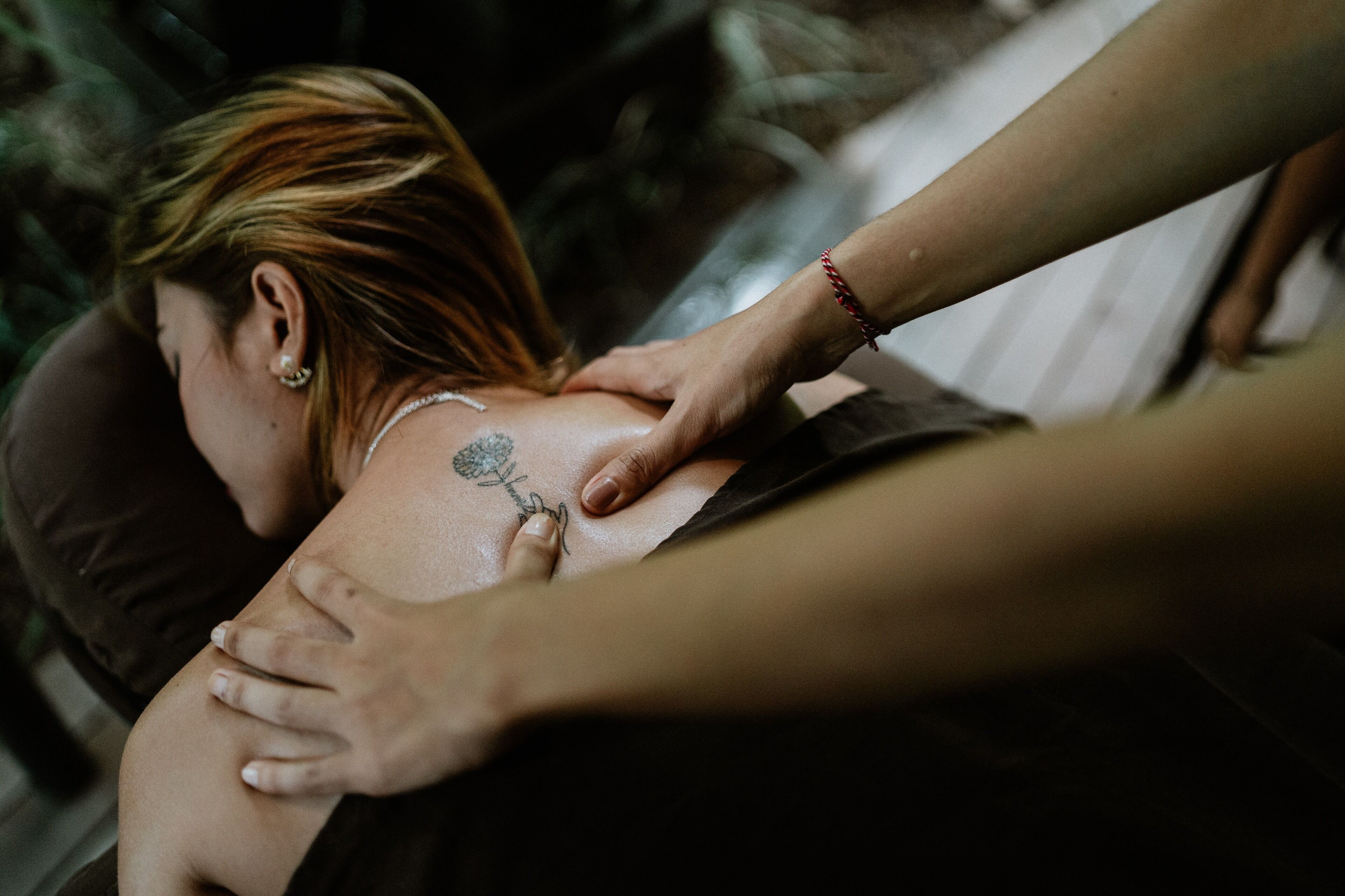 A person receiving a back massage.