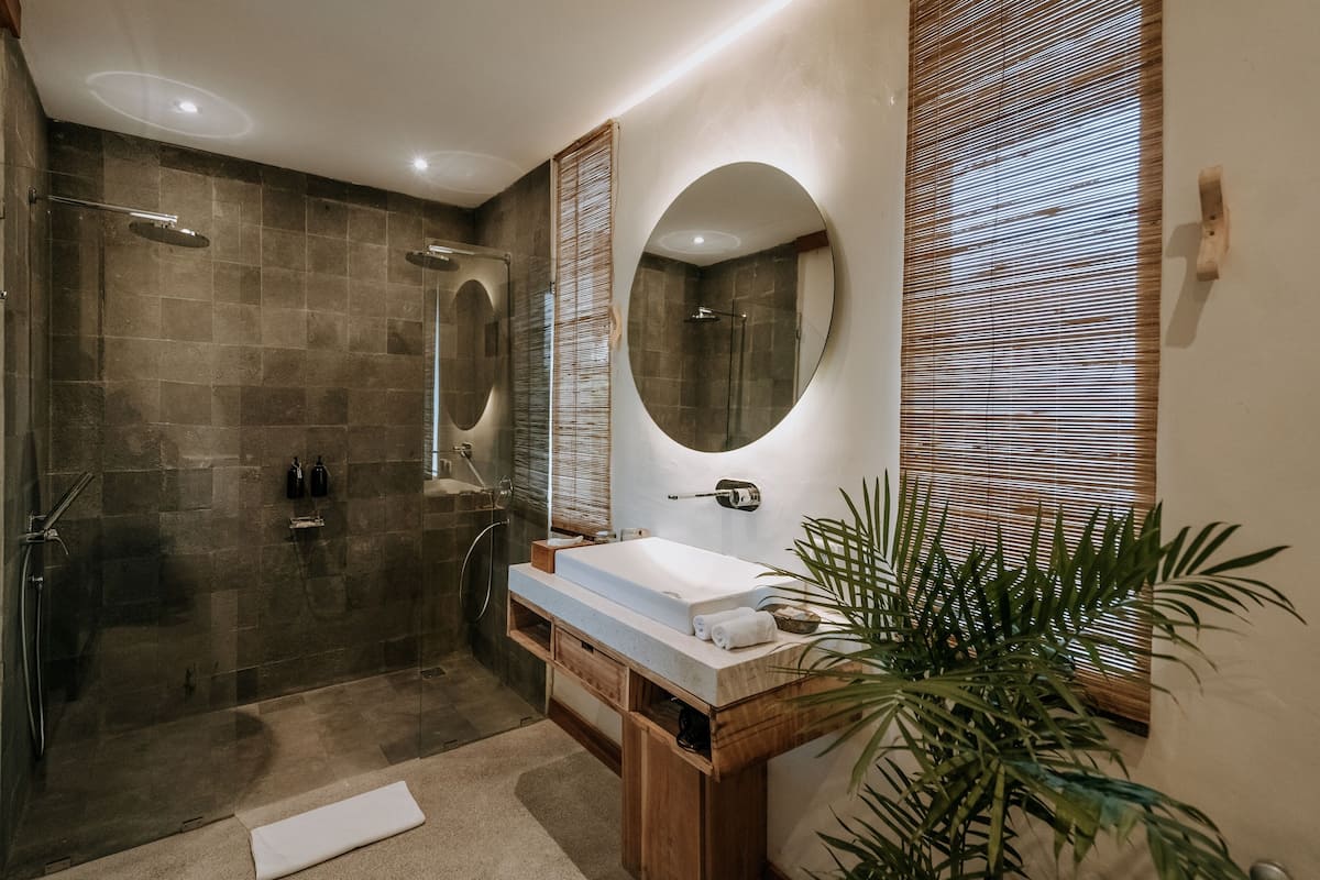junior suite | bathroom | shower, free toiletries, hair dryer, bathrobes