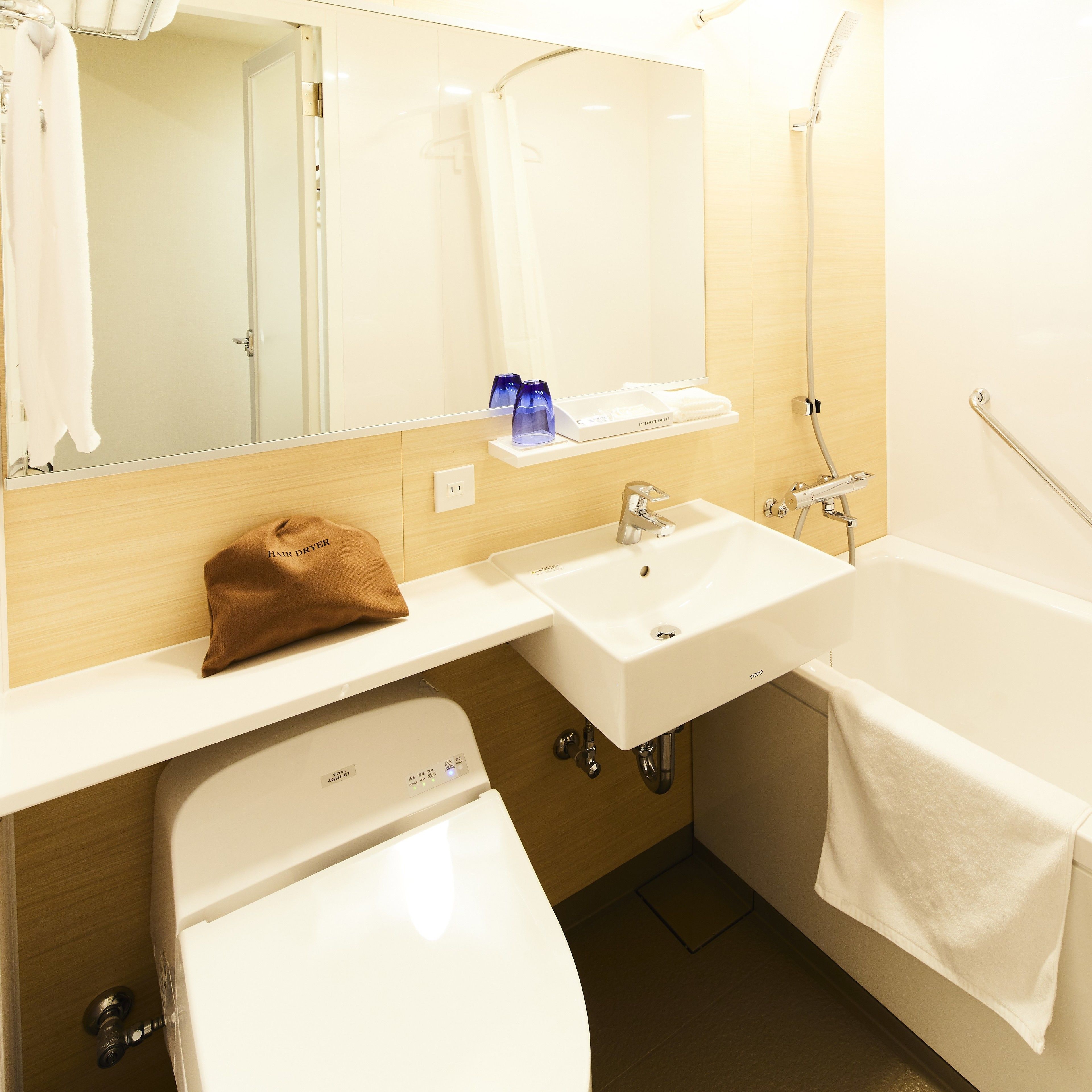 Combined shower/tub, free toiletries, hair dryer, slippers