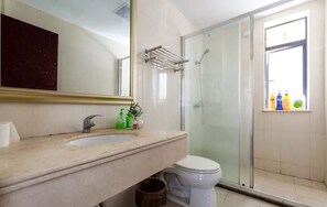 Shower, hair dryer, slippers, towels