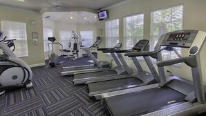 A fitness center with treadmills, elliptical machines, and a stationary bike. - Ly53790 - Windsor Palms Resort - 3 Bed 3 Baths Townhome (Kissimmee)