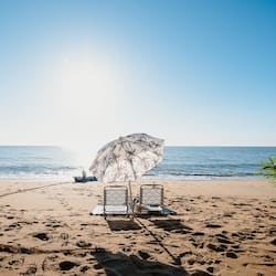 On the beach, sun-loungers, beach umbrellas, beach towels