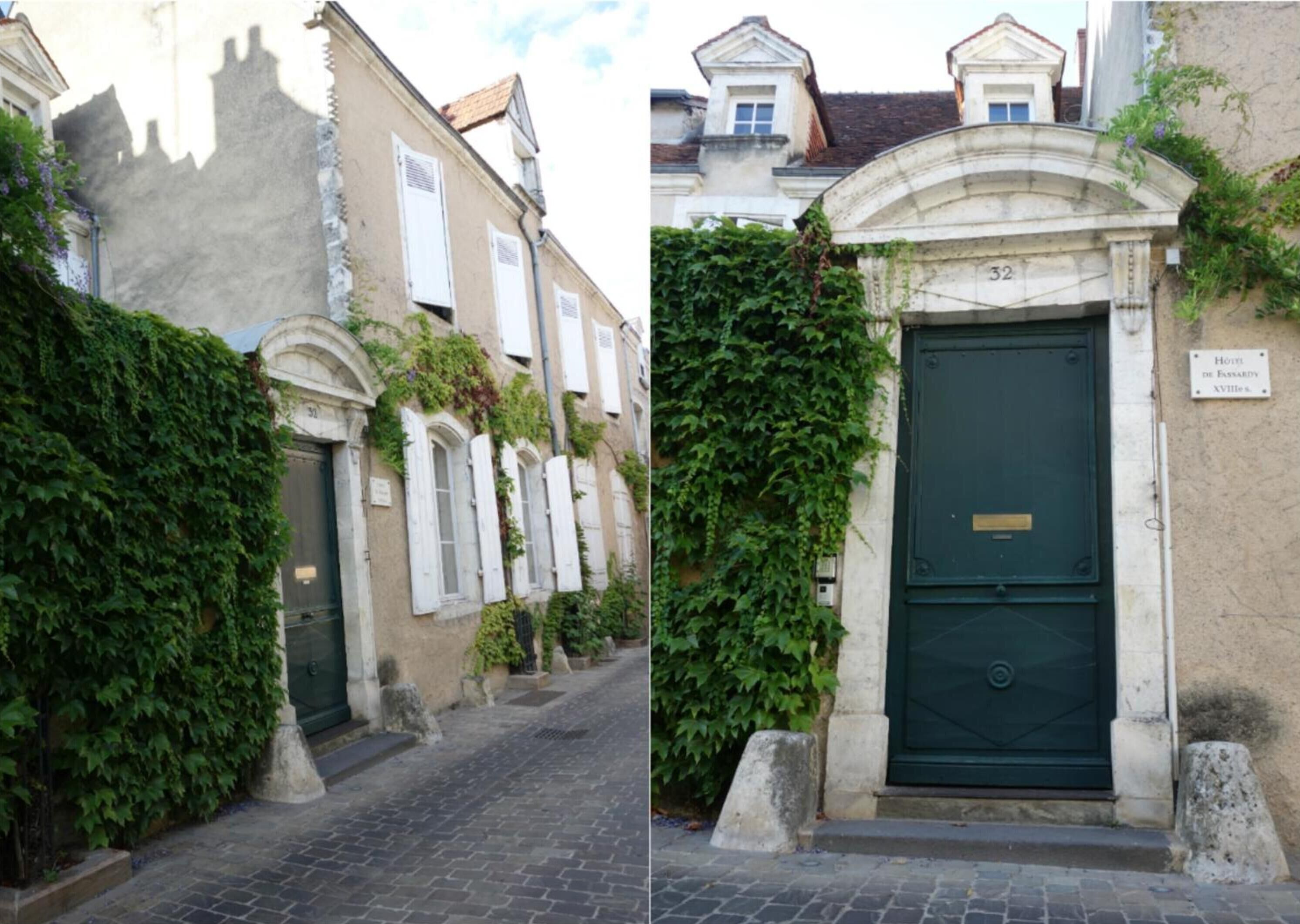 A narrow cobblestone street with a building featuring a green door and a sign indicating it is the Hotel de Fannardy XVilles.
