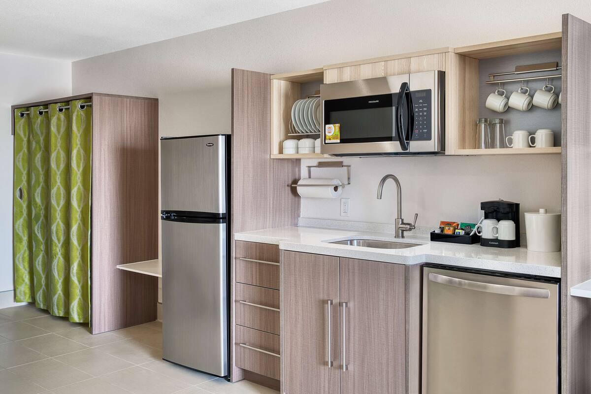 full-sized fridge, microwave, dishwasher, coffee/tea maker